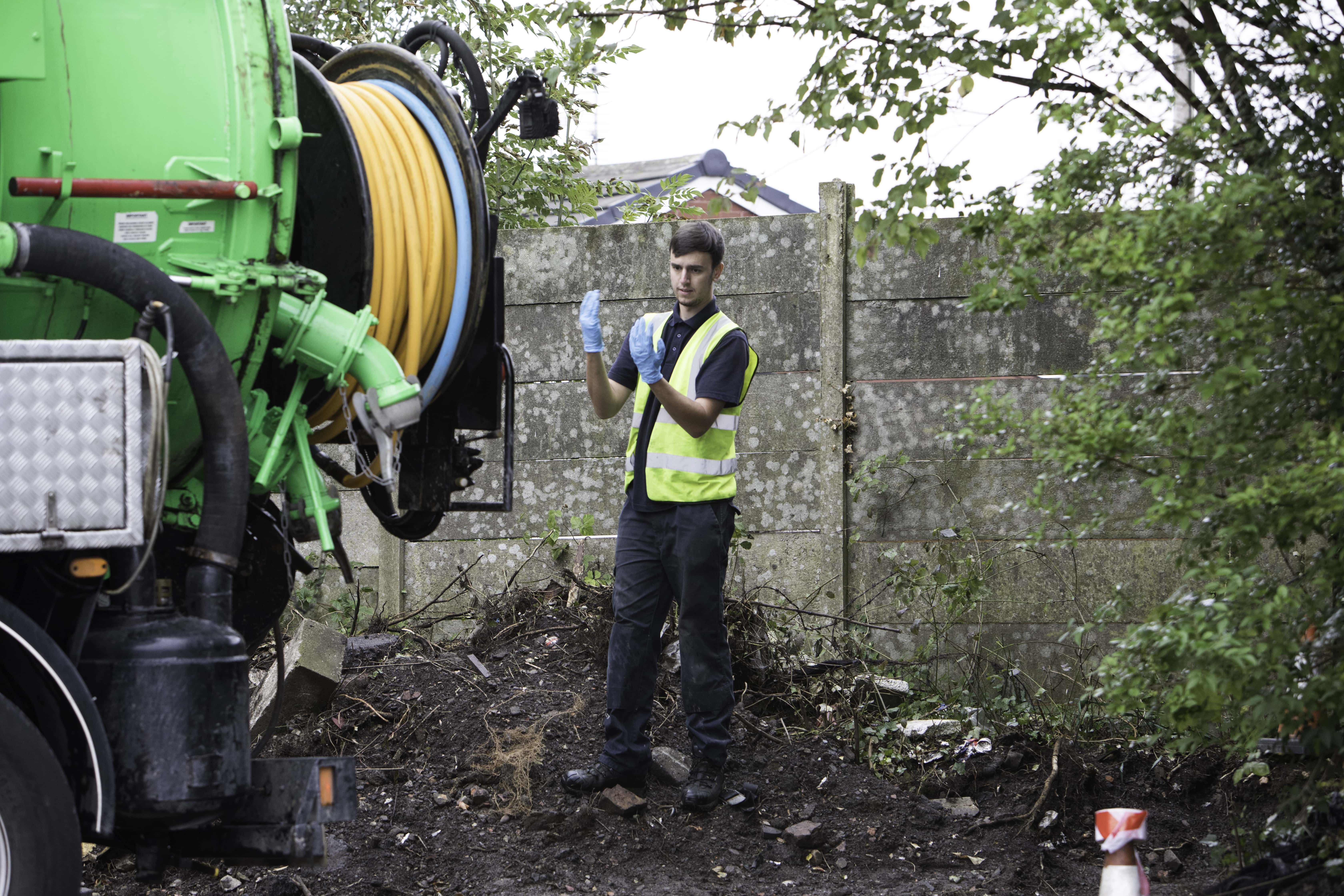 man emptying a septic / cesspit tank 