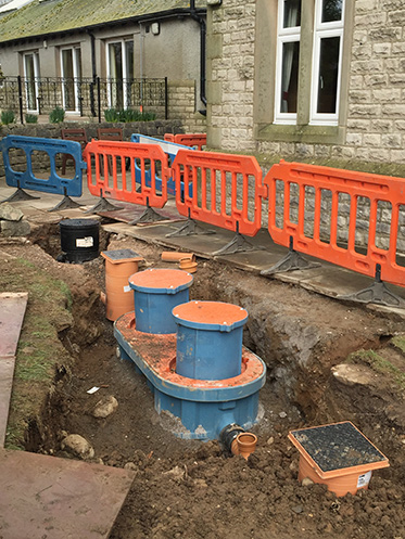 Road Dug Up and Cordoned off for Below Ground Grease Trap Installation  