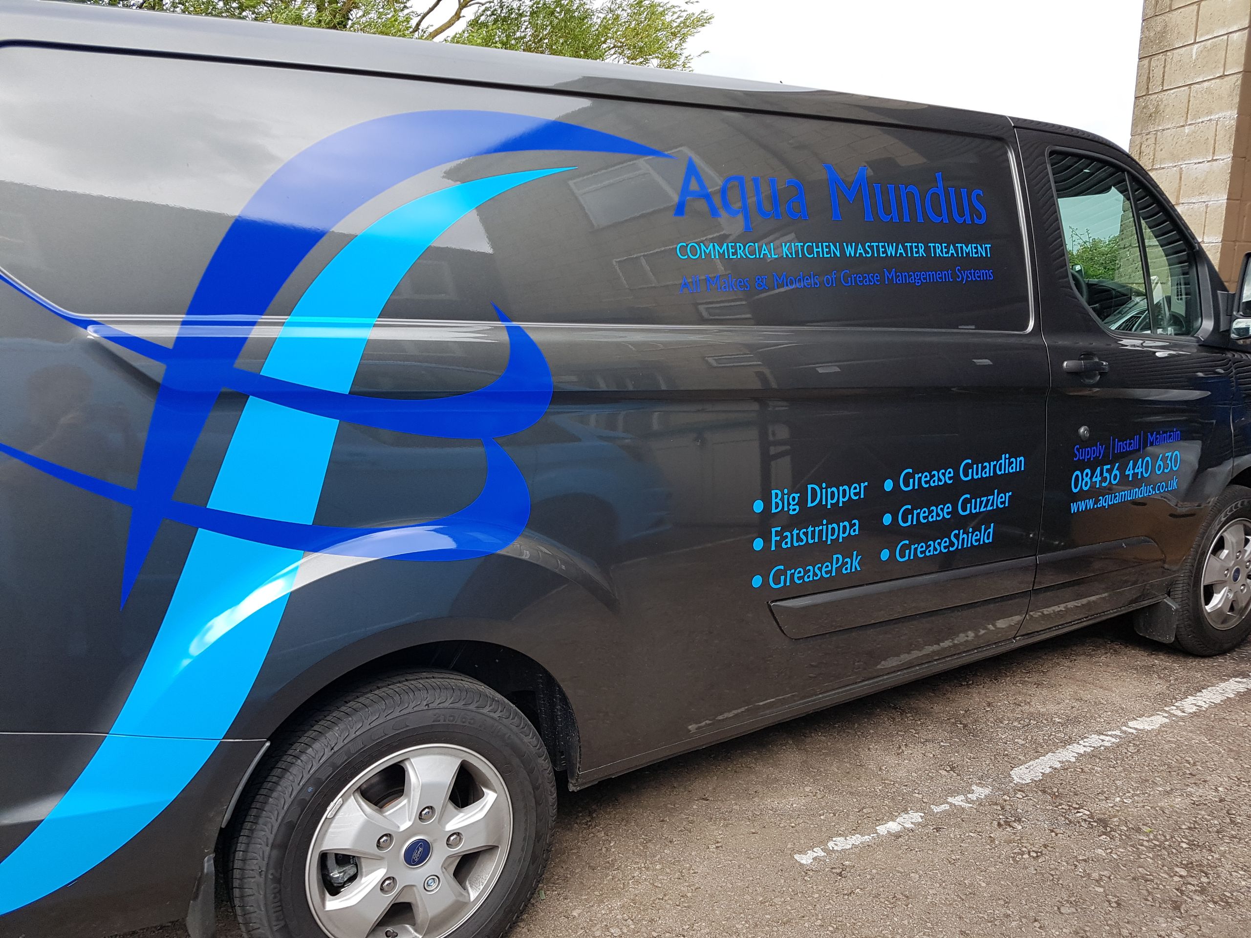 Aqua Mundus Van Parked on Drive