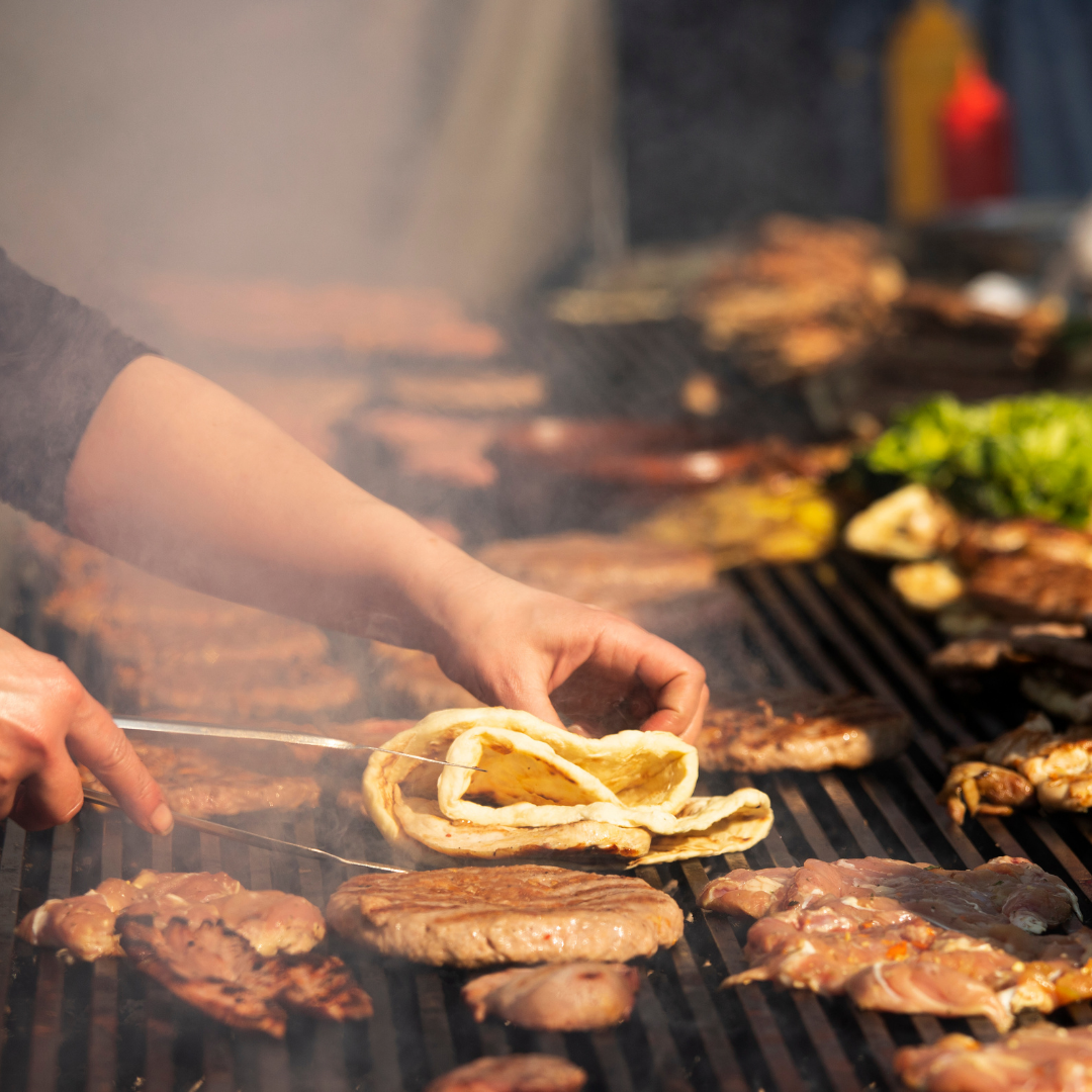 food cooking on bbq at food festival